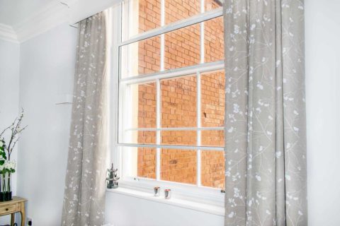 secondary glazing with curtains