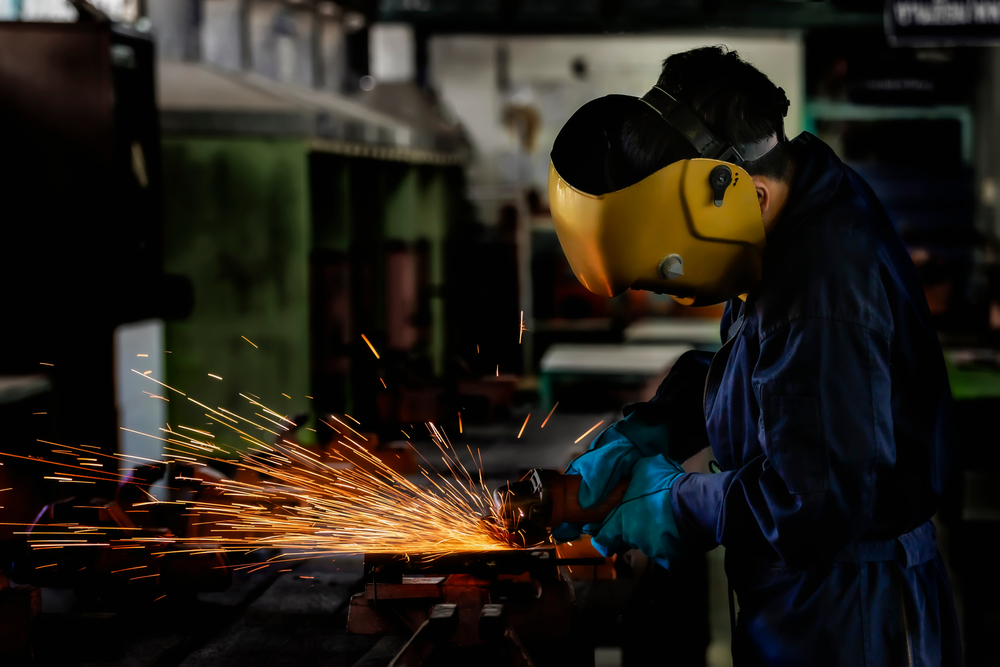 a man performing manufacturing process