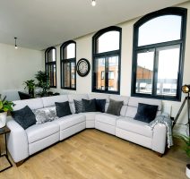 Room with sofa set and secondary double glazing